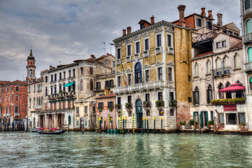 Fototapeta na wymiar Historical houses on a canal in Venice, Italy