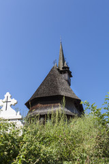 Fototapeta na wymiar Beautiful old medieval small wooden church in Budesti, Romania