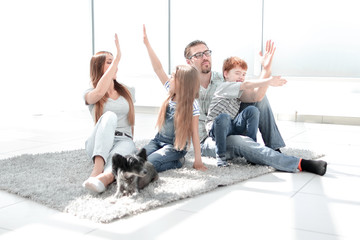 happy family with kids giving each other a high five