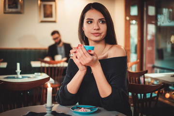 Beautiful woman sitting at the restaurant
