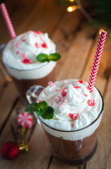 Close-up of Christmas mint hot chocolate on wooden background