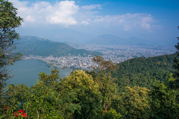 Pokhara town and Phewa Lake as seen on the way up to the World Peace Pagoda. Taken in Nepal, Dec 2018