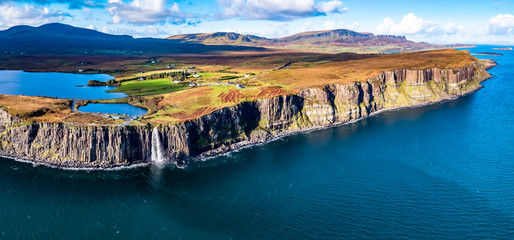 Aerial view of the dramatic coastline at the cliffs by Staffin with the famous Kilt Rock waterfall...