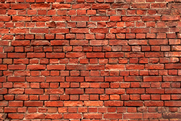 Naklejka premium Part of the old wall of red brick.