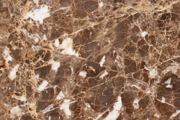 Granite texture with brown and gray spots. Used as a background.
