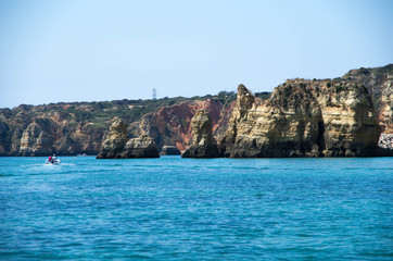Fototapeta na wymiar Rocky formations from Ponta da Piedade with boat on the left sid