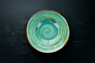 Creative Dinner Plates on Wooden background. Free space for your text. Top view.