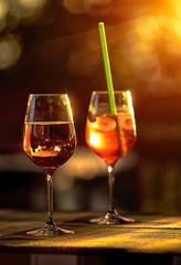 Two glasses with wine and cocktail outdoor