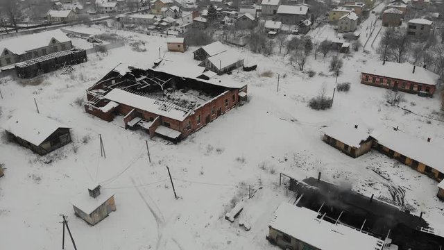 Aerial view of ancient center of saltmaking in Drohobych. Abandoned condition of salt factory, but functionate. Smooth flight straight ahead, 4k