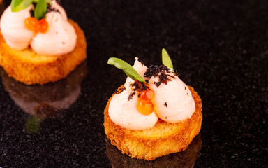 A toast with fish mousse and a crumb with greens