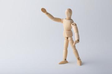 Wooden dummy standing with open arms
