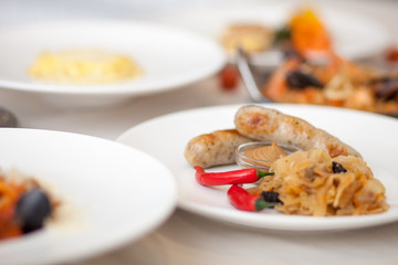Sausages with mustard, cabbage and red pepper