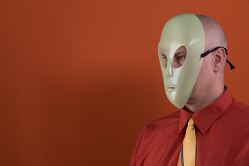 man in an alien mask