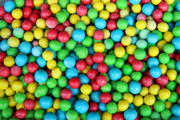 Fototapeta na wymiar colorful candy with nuts inside. dragee on the market