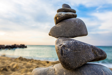 Stone cairn at the beach, concept of balance