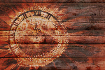 Fototapeta na wymiar The illustration on the wooden background of the abstract clock showing the approach of the new year