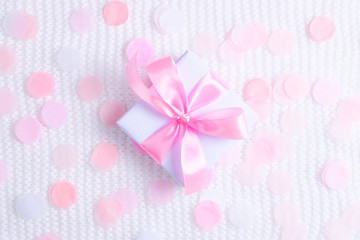 Beautiful gift box on white background with confetti.
