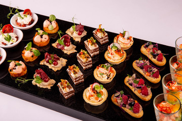  Giving of sets on a black granite background
