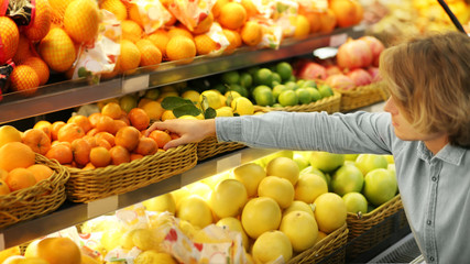 Young man buying fruits at the market