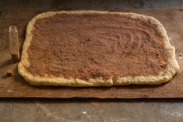 cinnamon buns - Cinnabon cooking process raw dough. (food background). copy space