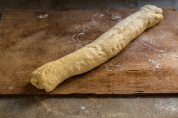 cinnamon buns - Cinnabon cooking process raw dough. (food background). copy space