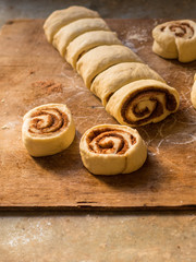 cinnamon buns - Cinnabon cooking process raw dough. (food background). copy space