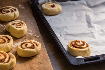 cinnamon buns - Cinnabon cooking process raw dough. (food background). copy space
