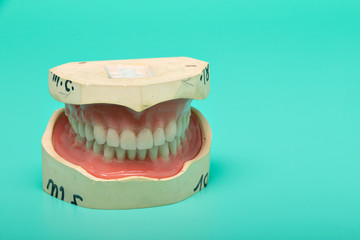 Dentures model with medical instruments