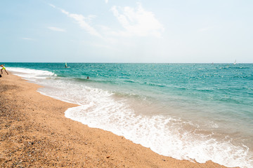 View of the sandy beach of the sea. Clouds