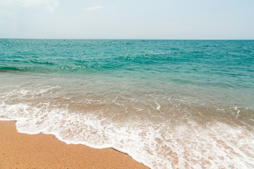 View of the sandy beach of the sea. Clouds