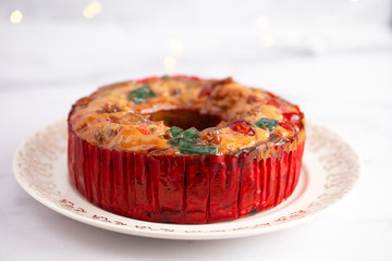 A Round Fruit Cake with Cherries Pineapples and Nuts Elegant Platter