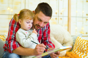 Cary father teaches toddler daughter to draw