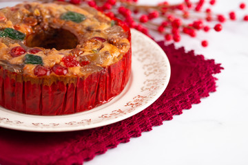 A Round Fruit Cake with Cherries Pineapples and Nuts Elegant Platter