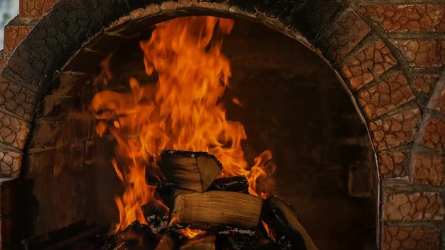 Romanian interior kitchen with an oven and a burning fire - Medium Shot