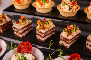 Supply of fat on bread black with caramelized onions and hot pepper