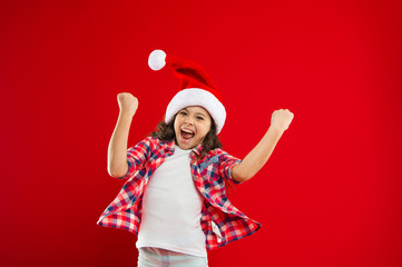 Ho Ho Ho. Happy winter holidays. Small girl. New year party. Santa claus kid. Christmas shopping. Present for Xmas. Childhood. Little girl child in santa red hat