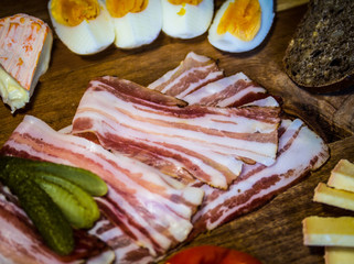 Bacon snack on a wooden snack plate