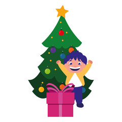 celebrating boy with christmas tree and gift