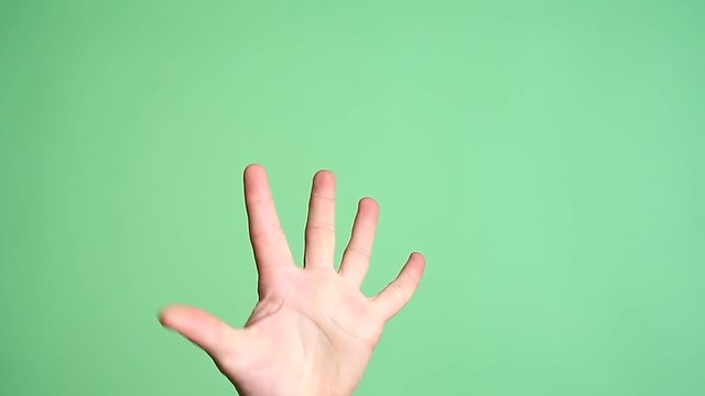 Male hand fingers counting one to five isolated green screen background