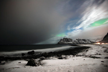 Brewing northern lights at Utakleiv in Lofoten archipelago