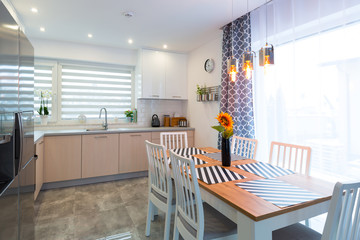 Modern kitchen interior with dining table