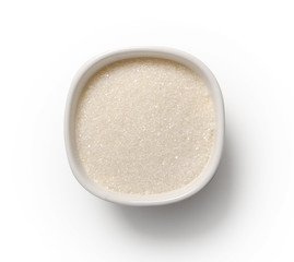 White bowl of sugar teaspoon on a white background isolation top view