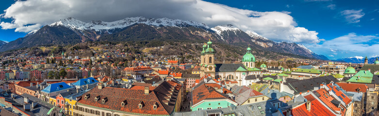 People in Innsbruck city center under Stadtturm tower. It is capital city of Tyrol in western Austria, Europe.