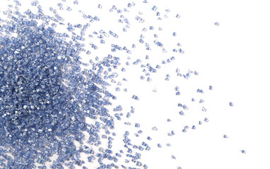 Blue crystal sugar sprinkles for cake, ice cream and pastries isolated on white background, top view