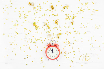 New Year composition alarm clock golden confetti
