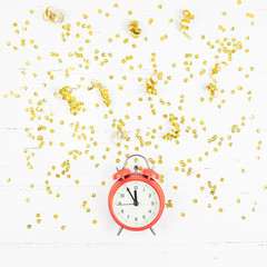 New Year composition alarm clock golden confetti