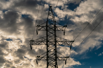 high-voltage line on the background of cloudy sky