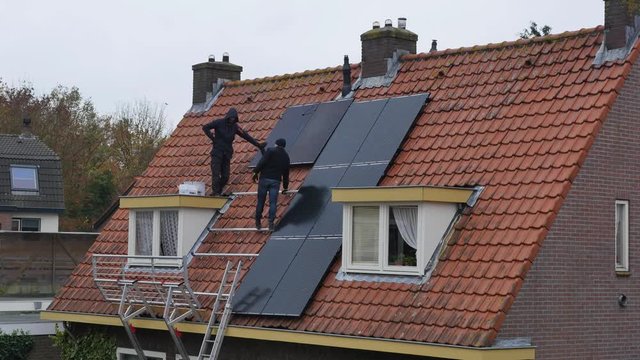 Timelapse of placing solar panels to a house