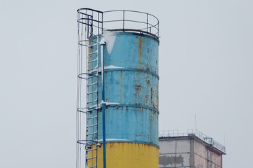 Old industrial iron pipe with a ladder