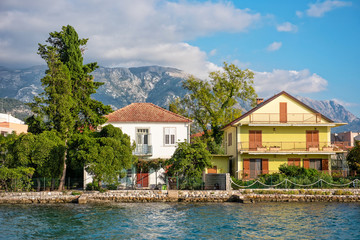Fototapeta na wymiar House with mountains view beside the sea in Montenegro